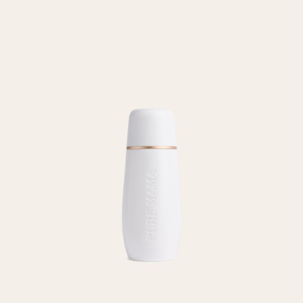 A white, cylindrical Pure Mama NZ Peri Wash Bottle with a rounded cap and gold band, embossed with PURE MAMA, designed for gentle postpartum care cleansing, set against a plain light beige background.