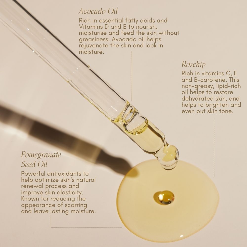 A dropper releases golden serum onto a beige surface, highlighting the Bump Love Set by Pure Mama NZ—enriched with avocado, rosehip, and pomegranate seed oils to help prevent stretch marks and deeply nourish as a Belly Oil.