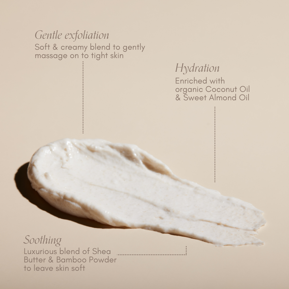 A creamy swipe of Bump Love Set by Pure Mama NZ is shown on beige, showcasing its gentle exfoliation, hydration with coconut and almond oils, soothing with Shea Butter and Bamboo Powder for soft skin and stretch mark prevention.