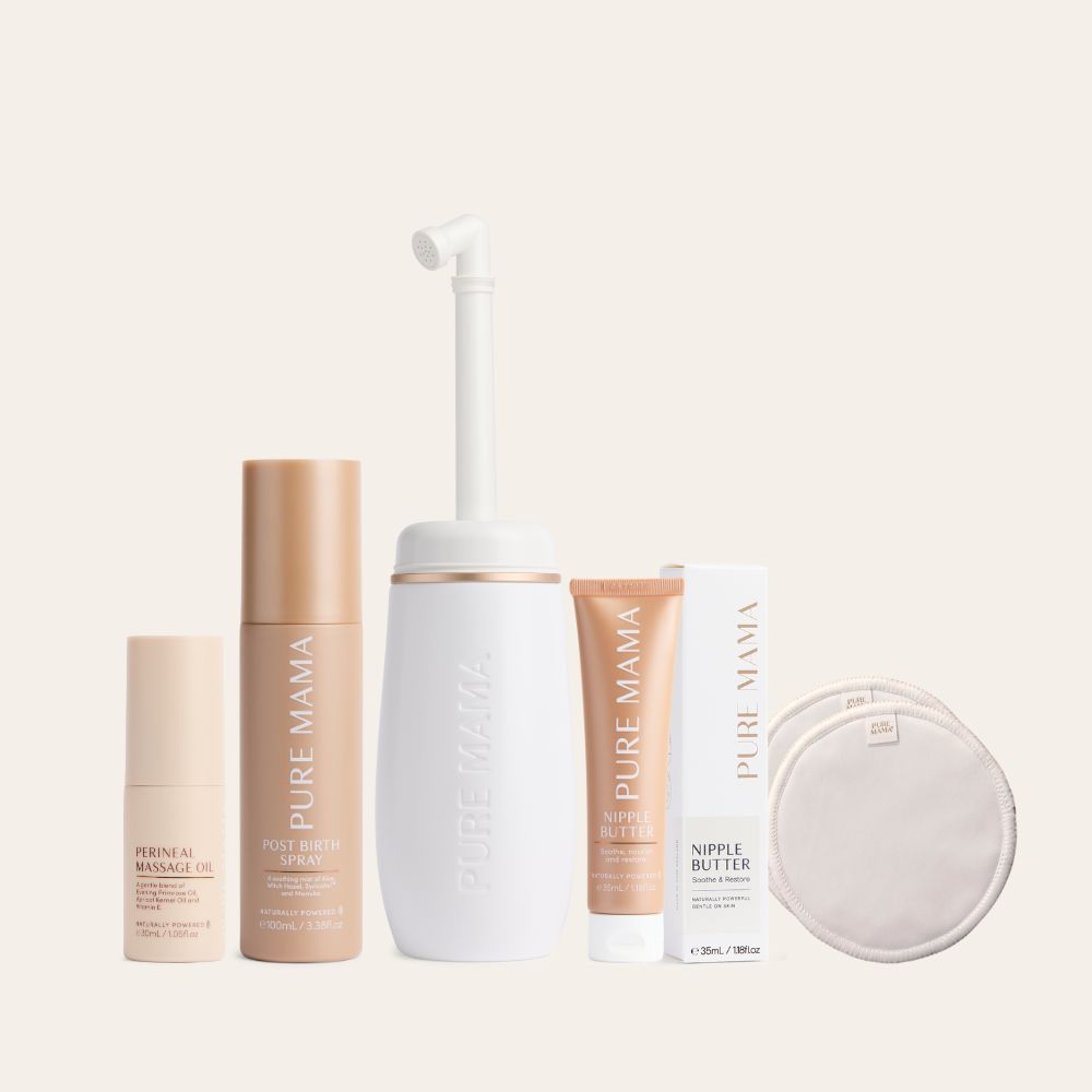 The Pure Mama NZ Birth & Postpartum Recovery Kit—with perineal massage oil, post birth relief spray, peri bottle, nipple butter, box, and two reusable nursing pads—is displayed side by side on a light background.
